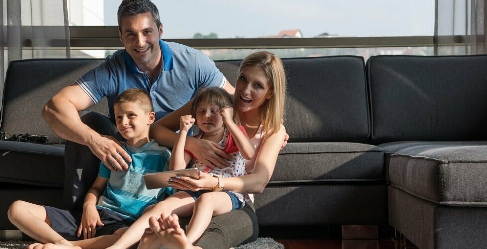 happy young couple spending time with kids