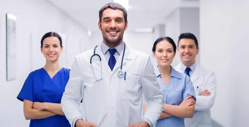 happy group of medics or doctors at hospital