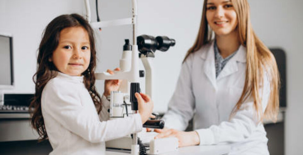 Little girl checking up her sight at ophthalmology center